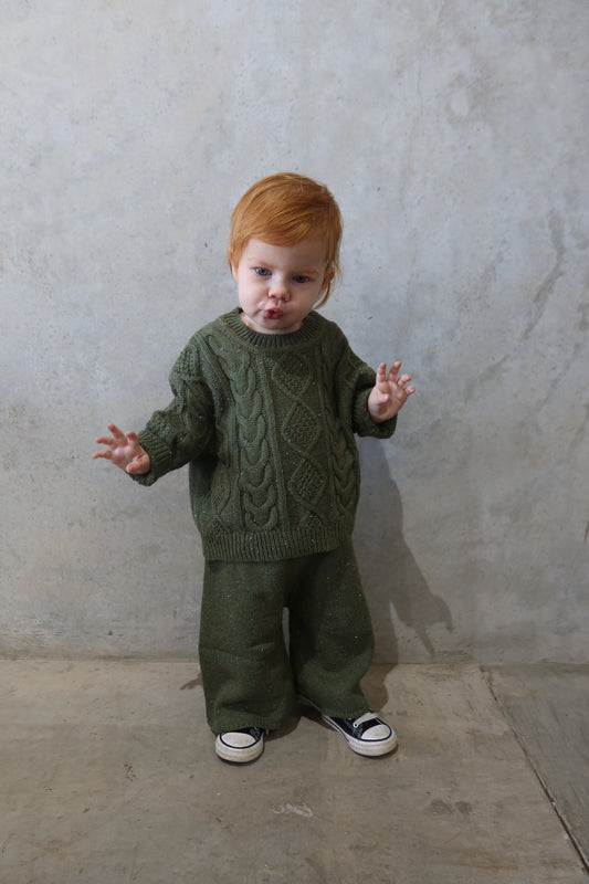 Full body shot of child walking in the Funfetti Knitted Set, showing relaxed fit and playful movement.